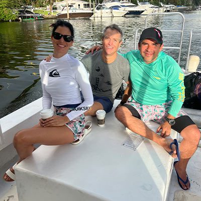 Guests relaxing on a private scuba dive charter boat docked in a Miami marina.